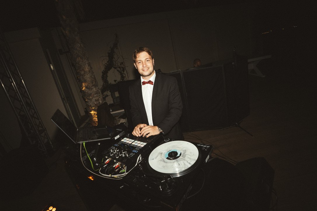 DJ Dimitris Vlisidis behind the decks at a wedding