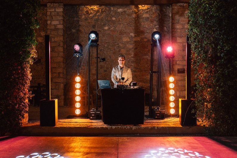 DJ booth with moving heads and retro lights